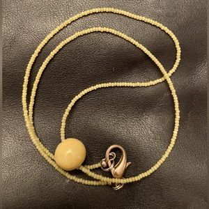 22” seed bead necklace with one large ceramic bead @ 1/2”.  Handcrafted